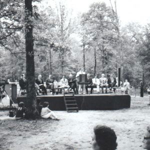 People on stage and in front of stage