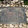 Bronze plaque set into monument composed of quartz crystal