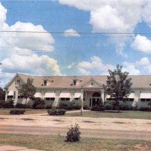 white hospital building with sloped roof