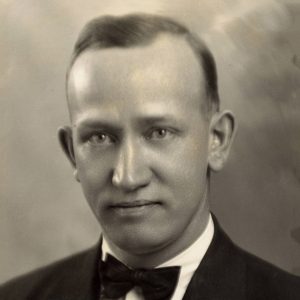 White man in suit and bow tie