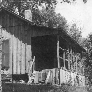 Single story wooden house with covered porch