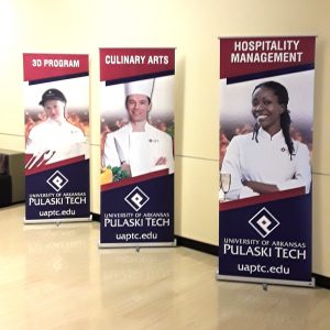 Three displays advertising "3D Program" "Culinary Arts" and "Hospitality Management"