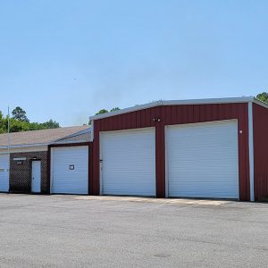 Combination brick and metal building with multiple front-facing bays