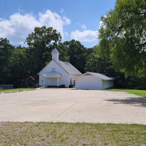 white wooden church buildings