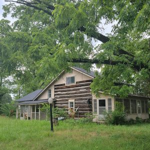 Multistory log cabin with modern structures added