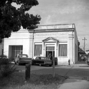 Single story marble building with "Citizens Bank and Trust Company" engraved on it