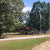 Pavilion with picnic tables behind fence