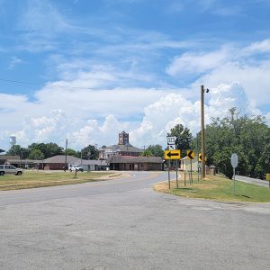 Intersection with curve in road and various buildings