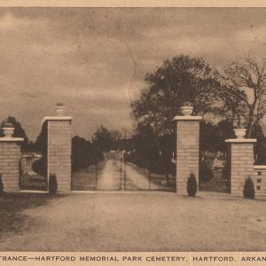 Metal gate with brick pillars flanking it