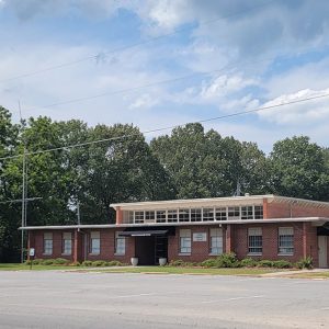 Red brick two-story building with flat roof