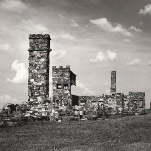 Scant remains of a rock building with some tall sections remaining