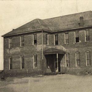 Multistory brick building with covered entrance