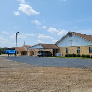 Multistory tan and white church building