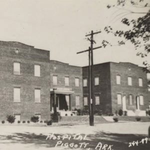 Multistory brick building with rows of windows