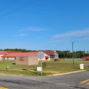 Yellow brick buildings with red roofs