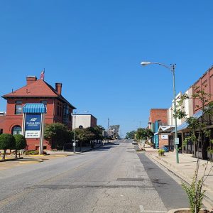 Small town street lined with various storefronts