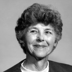 smiling white woman with wavy short brown hair