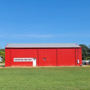 Single story bright red metal building