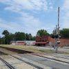 Small town main street running alongside raidroad tracks