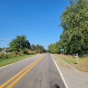 Country road entering small community