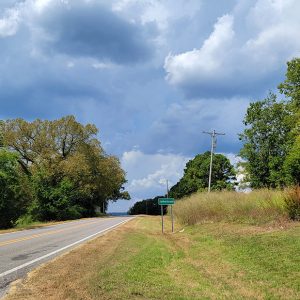 Country road cresting hill