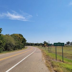 Country road curving into small town