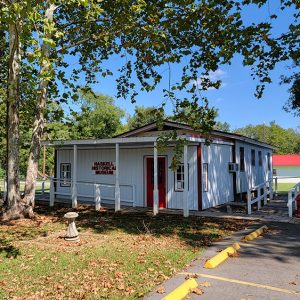 White wooden museum buildings with red trim