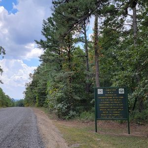 Gravel road cresting hill