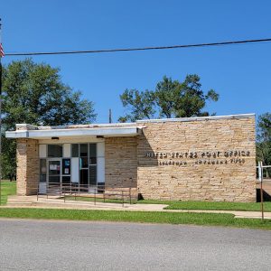 Single story tan sandstone post office building