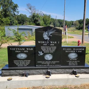 Marble memorials labeled "Vietnam War" and "World War I" and "Pearl Harbor"