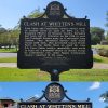 Two sides of metal sign saying "Clash at Whitten's Mill"