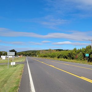 Country highway entering small town