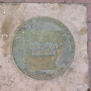 Round metal marker with words