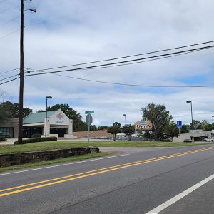 Small town business district with cars and buildings