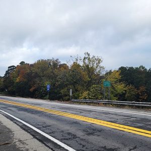 curving country road entering small town