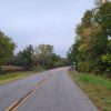 curving road going over bridge over creek