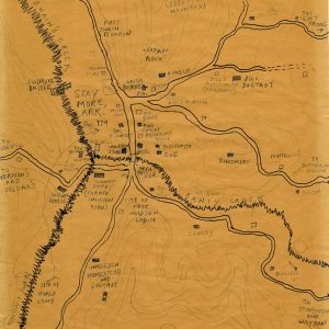 a yellow map with handwritten notations of roads and locations