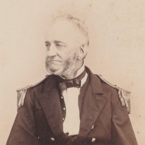 white man in military regalia sitting in chair