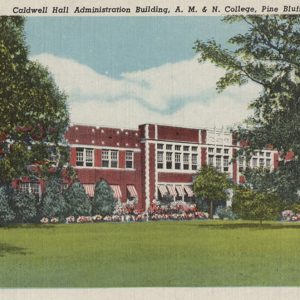 Multistory red brick college building with striped awnings on lower windows