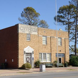 Multistory block-shaped orange brick building