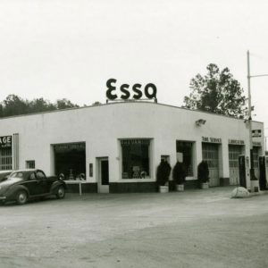 White single story concrete block gas station building