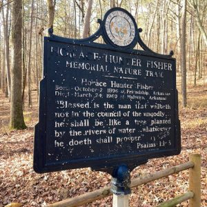 Sign with the great seal of Arkansas and information about a hiking trail