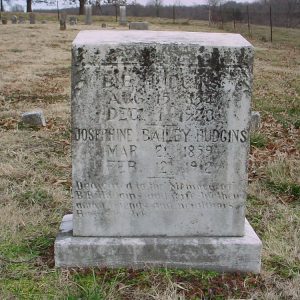 faded tombstone in cemetery