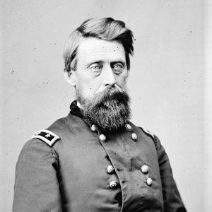 Bearded white man in military garb