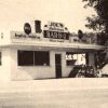 Single story white concrete block restaurant building "Joe's Bar-B-Q"