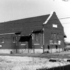 Brick depot building with boarded up windows