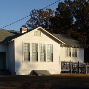 Single story white wooden building