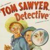 Movie poster featuring two young boys and a magnifying glass