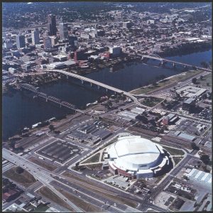 Aerial view of an arena and a downtown neighborhood