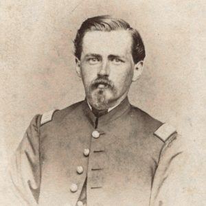 White man in military garb with mustache